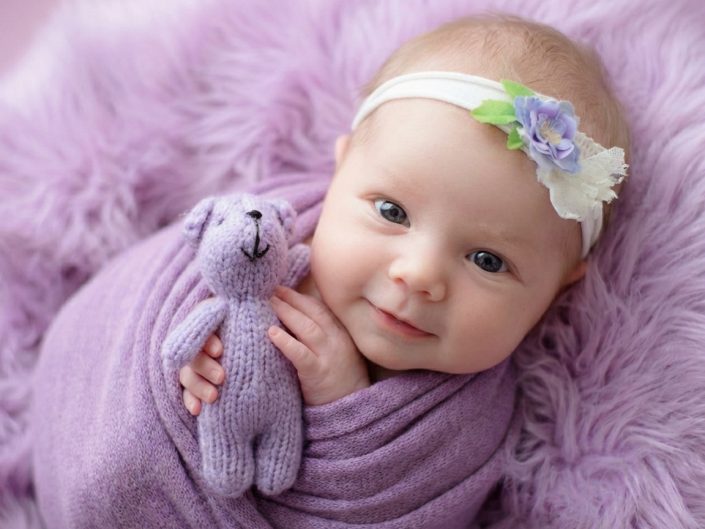 Older newborn baby wrapped in purple fabric at Sweetlife Photography North Lakes
